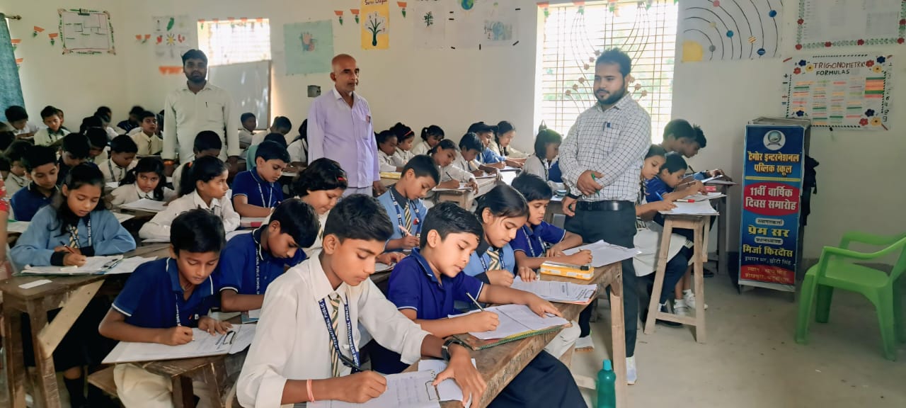 Students writing exams in classroom